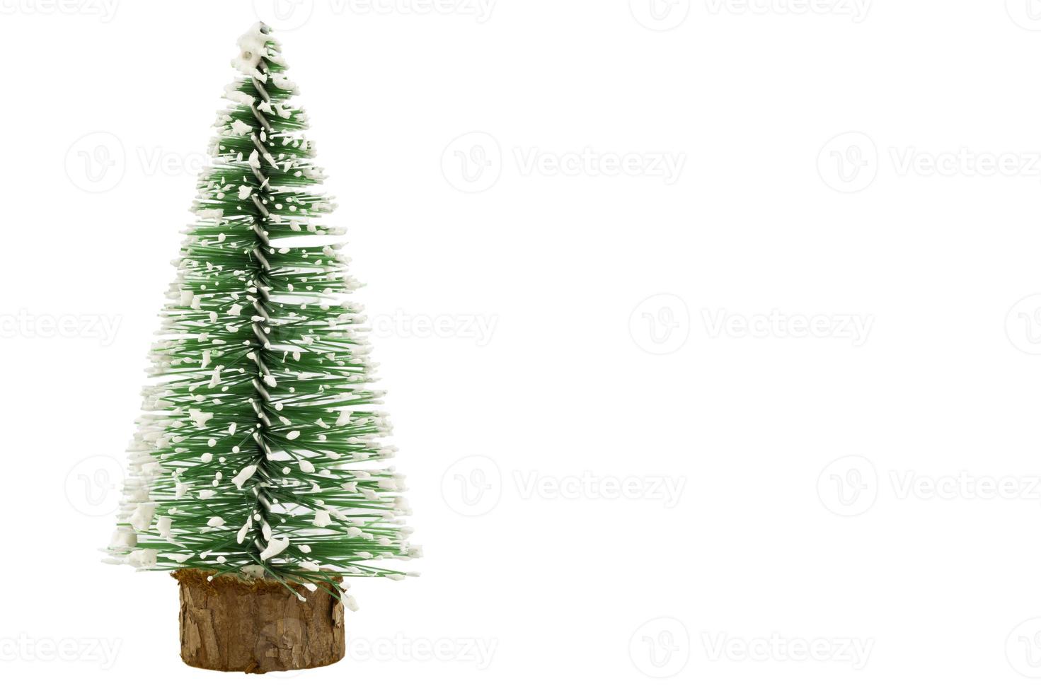 Small green christmas tree on a white background  with a clipping path inside photo