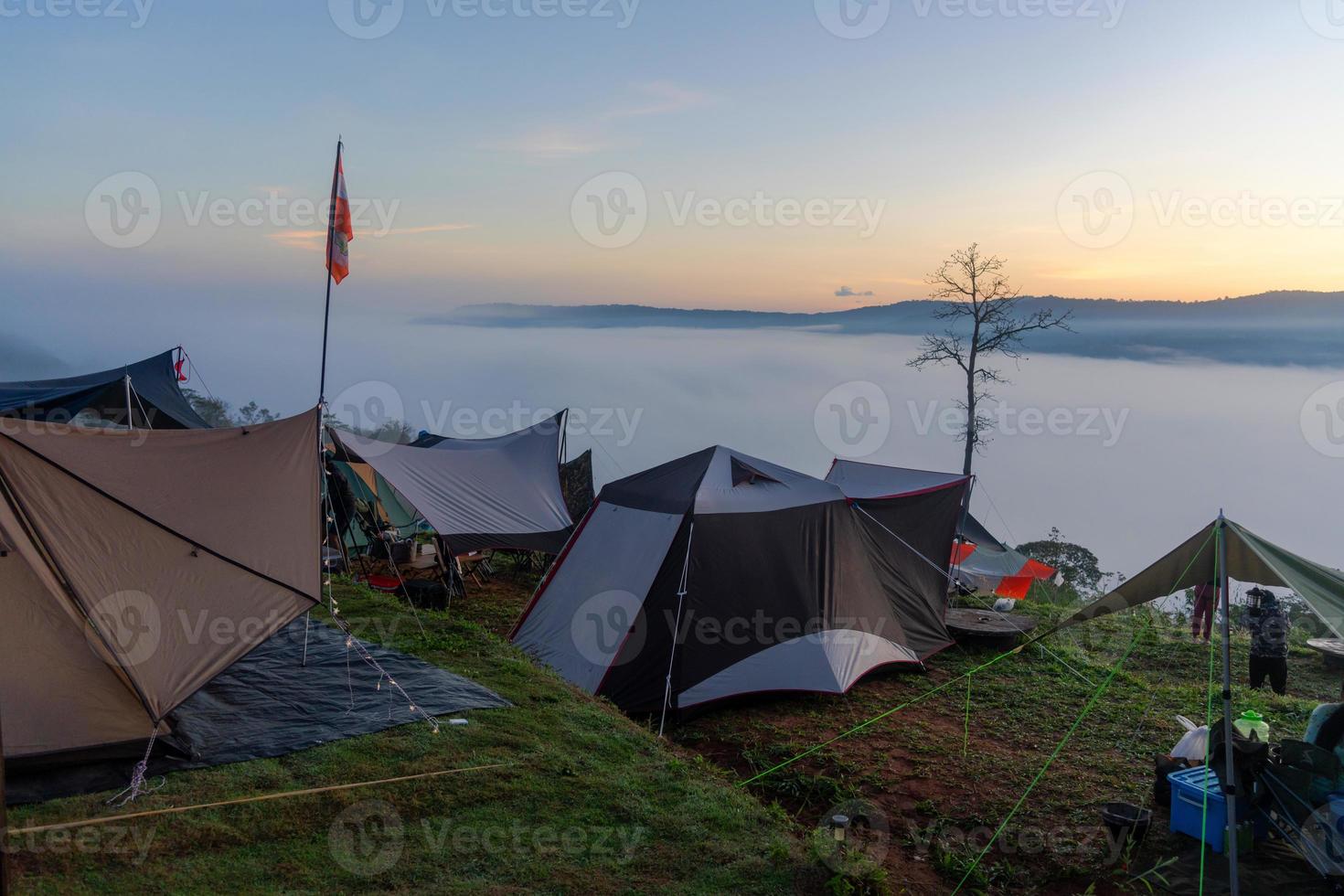 camping on the mountain enjoy with foggy beautiful landscape photo