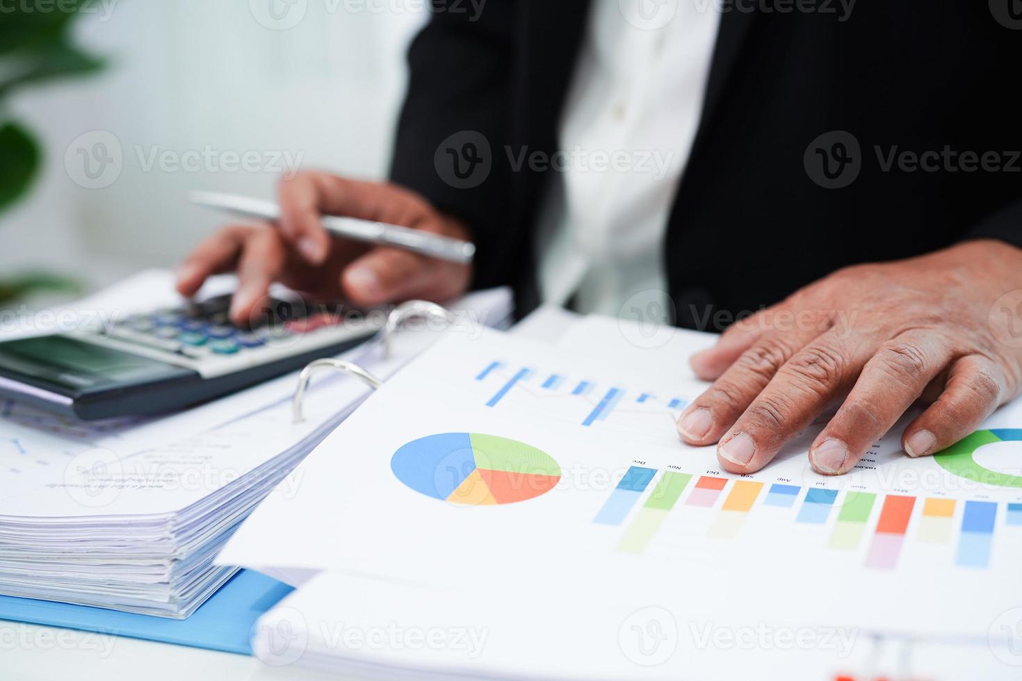 Business woman working and analysis with statistic graph in office. photo