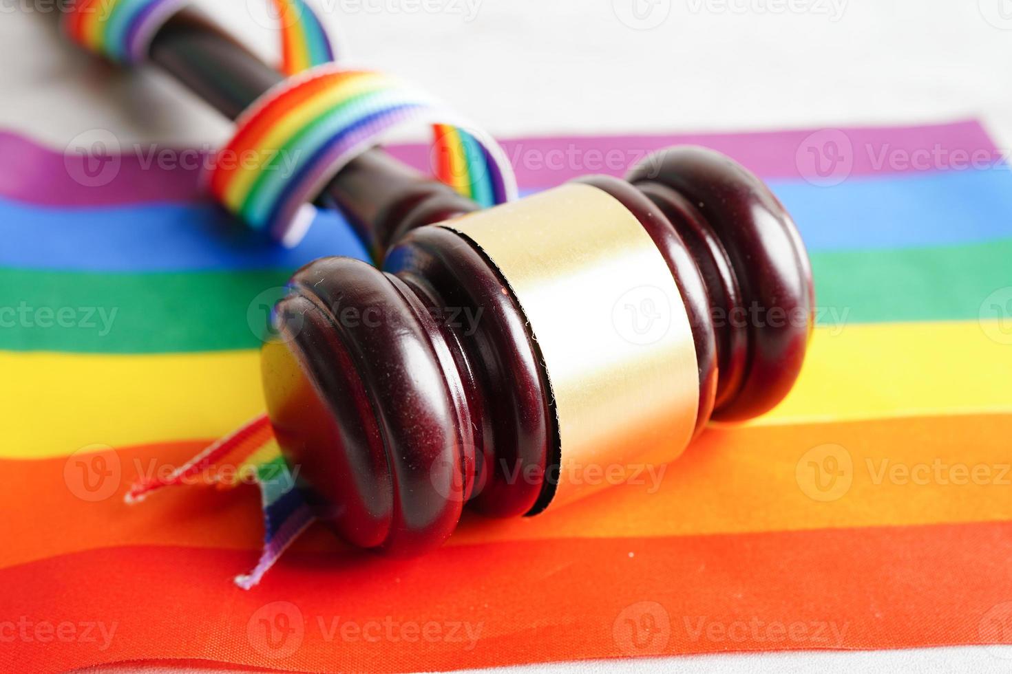 Asian woman with rainbow flag, LGBT symbol rights and gender equality, LGBT Pride Month in June. photo