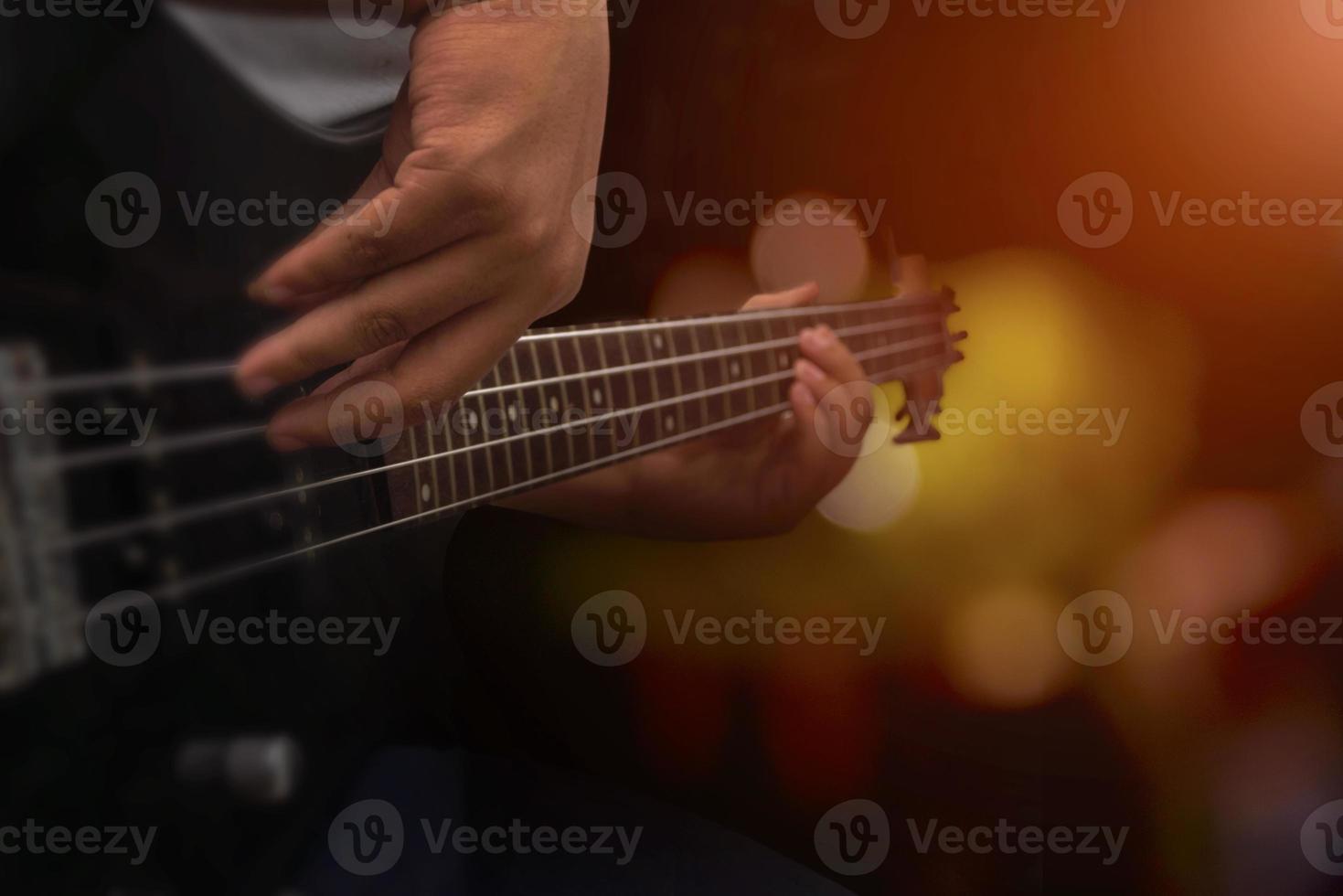 man playing a bass instrument photo