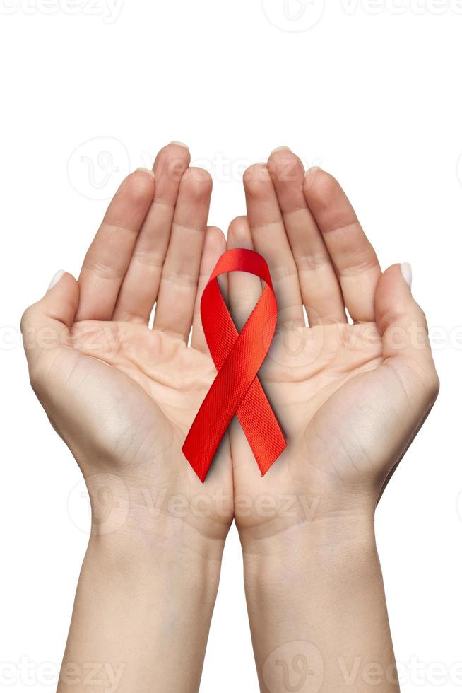 red ribbon for WORLD AIDS symbol held on white background isolated photo