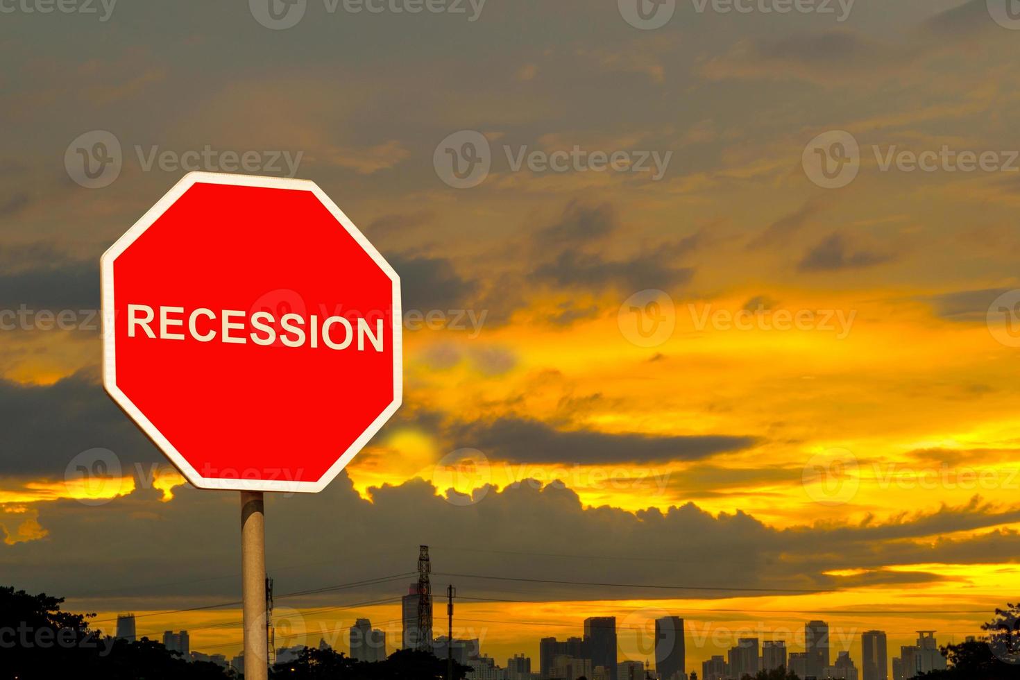 recession signpost with evening sky background photo