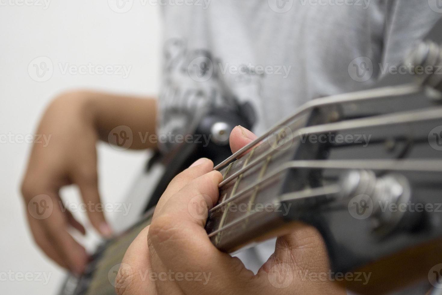 man playing a bass instrument photo