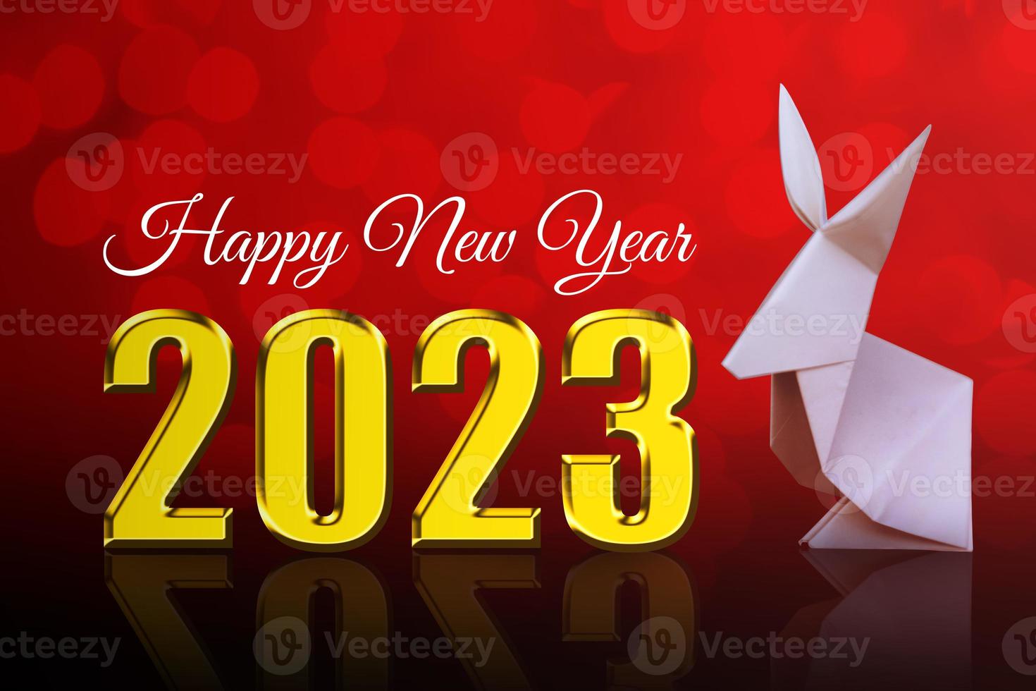 feliz año nuevo 2023 fondo rojo y conejo de origami foto