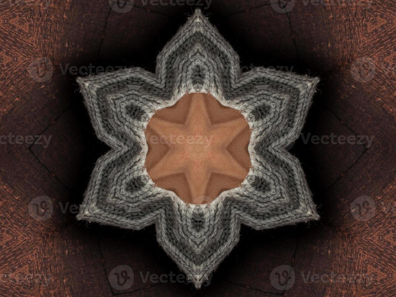 Abstract kaleidoscope background. Beautiful multicolor kaleidoscope texture. Unique kaleidoscope design. with a light brown base color and surrounded by dark brown photo