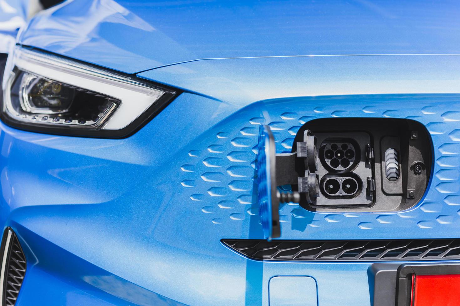 Close-up of front view electric car charging socket. photo