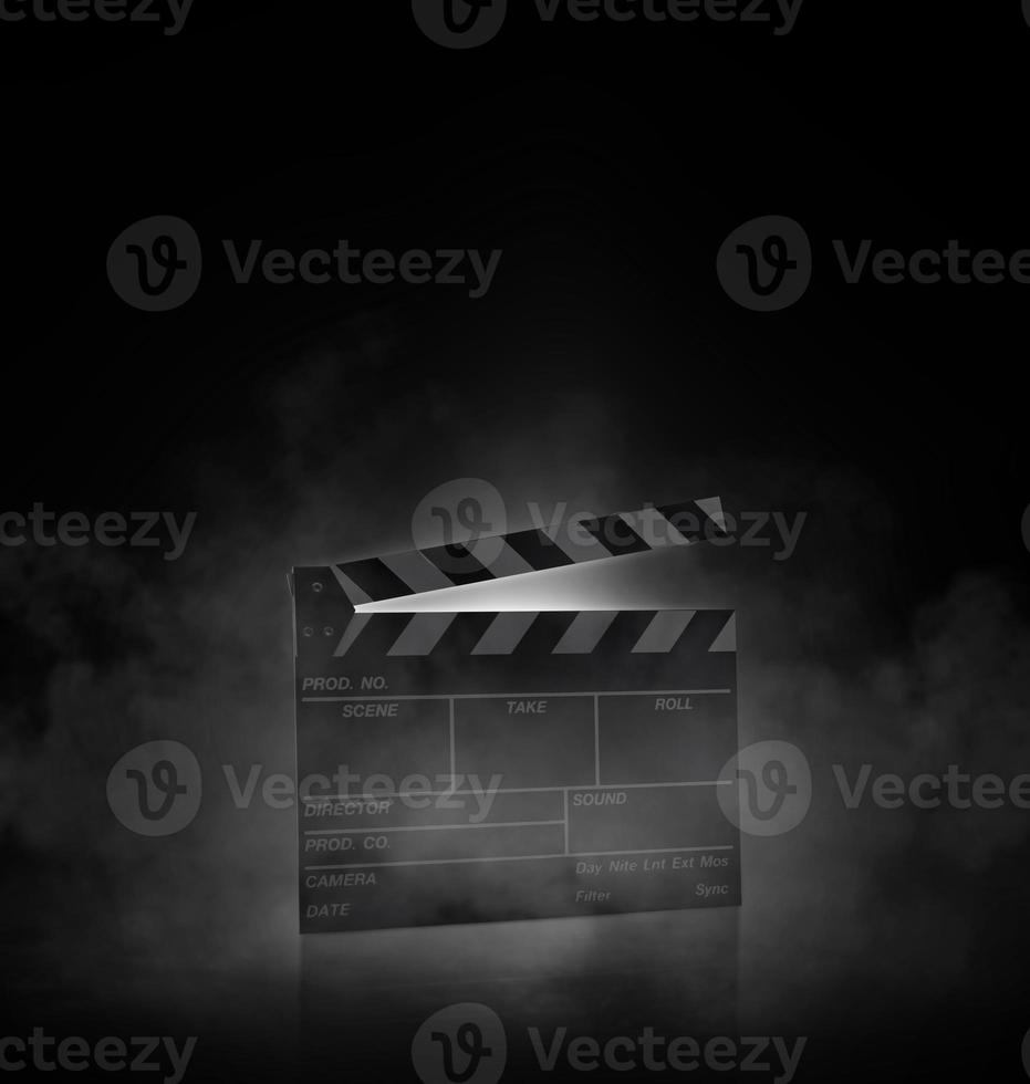 Movie clapper board on black background with smoke photo