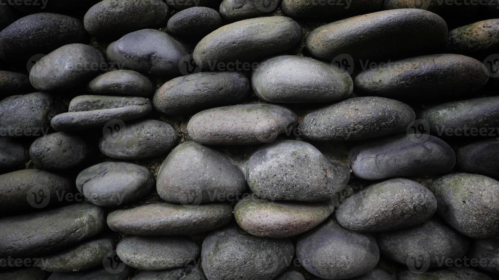 Photos of stones arranged on walls and plastered so that they look attractive as wallpaper and background.