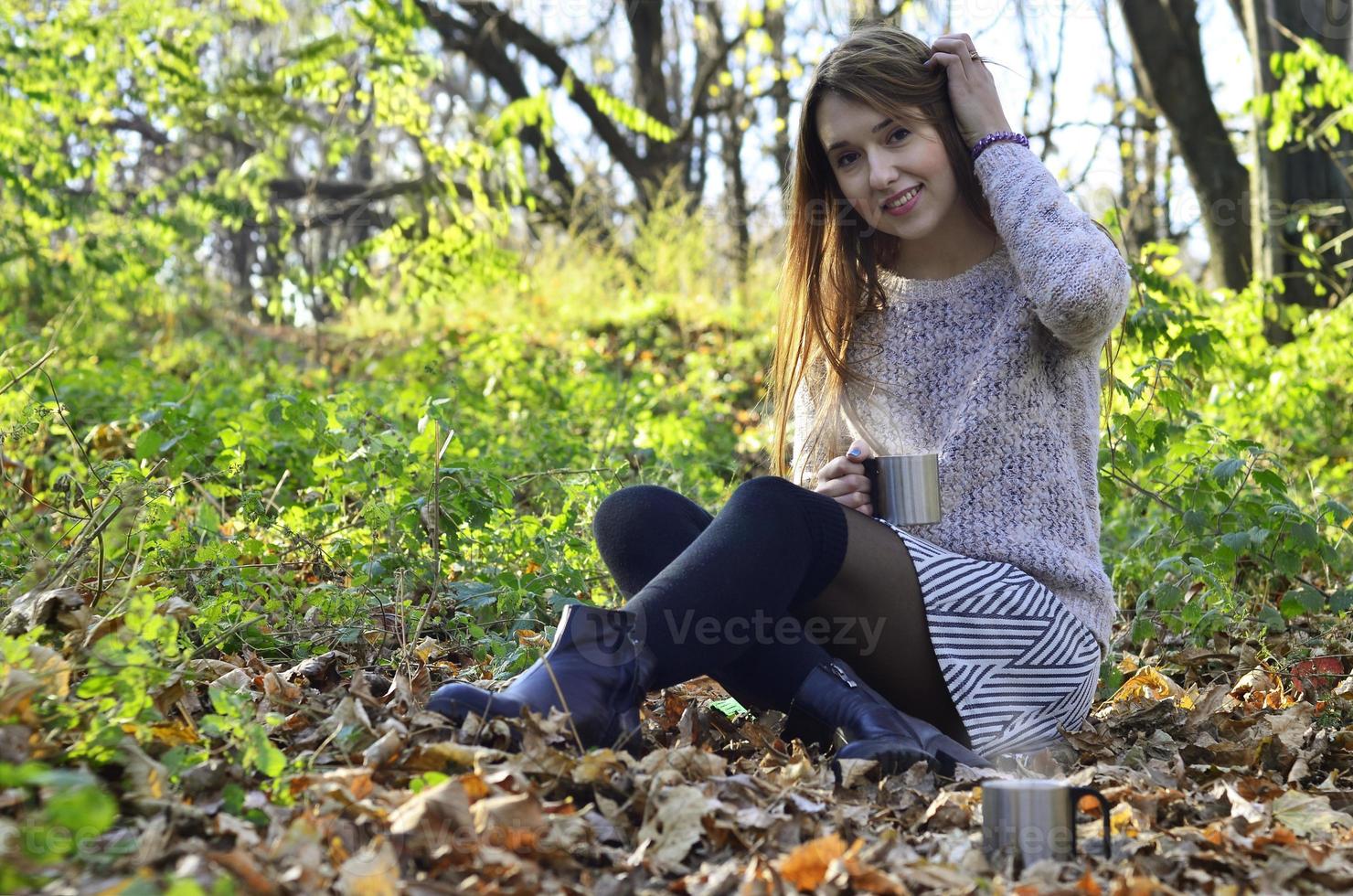 Girl holding a cup of coffee photo