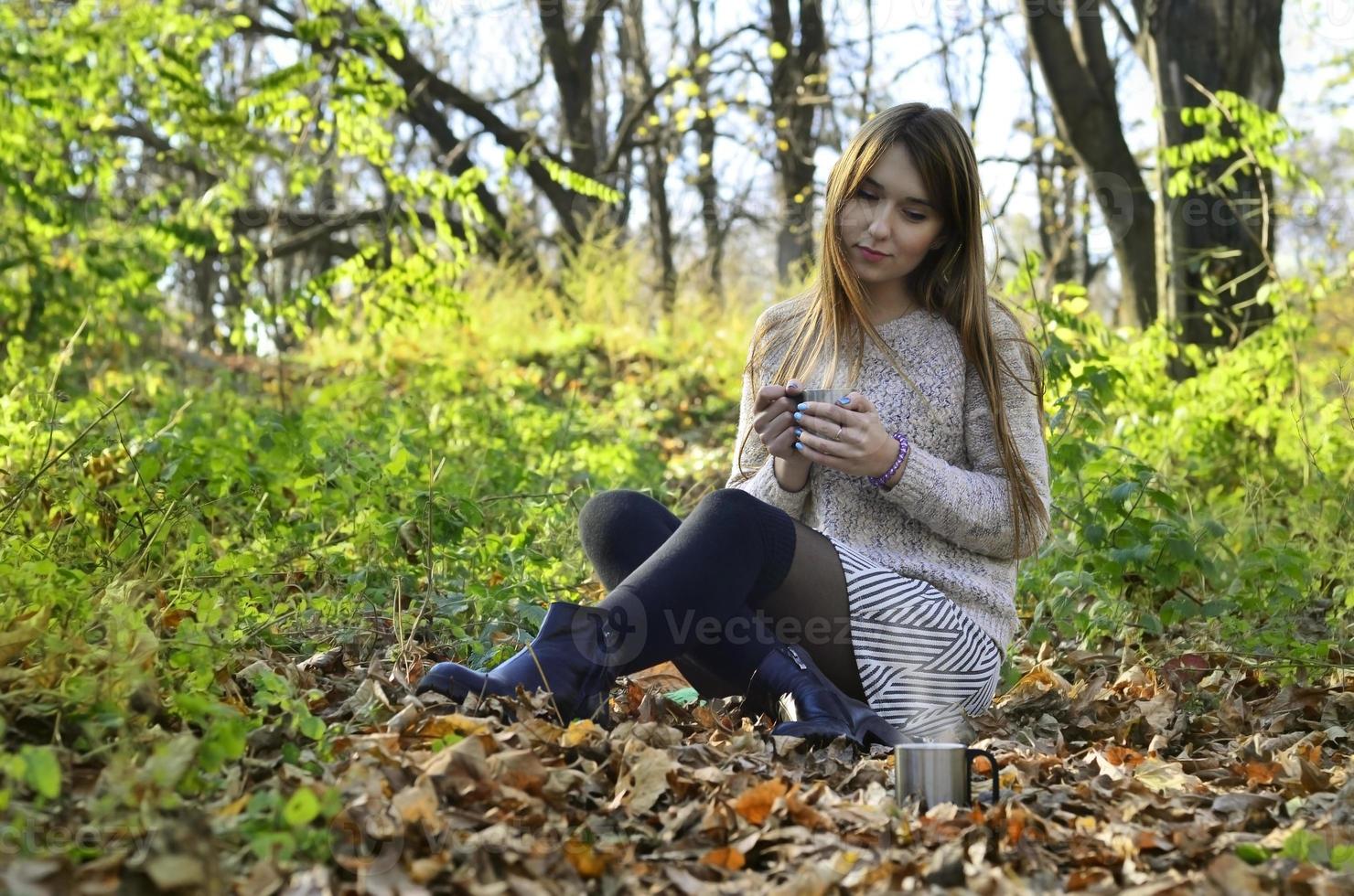 Girl holding a cup of coffee photo