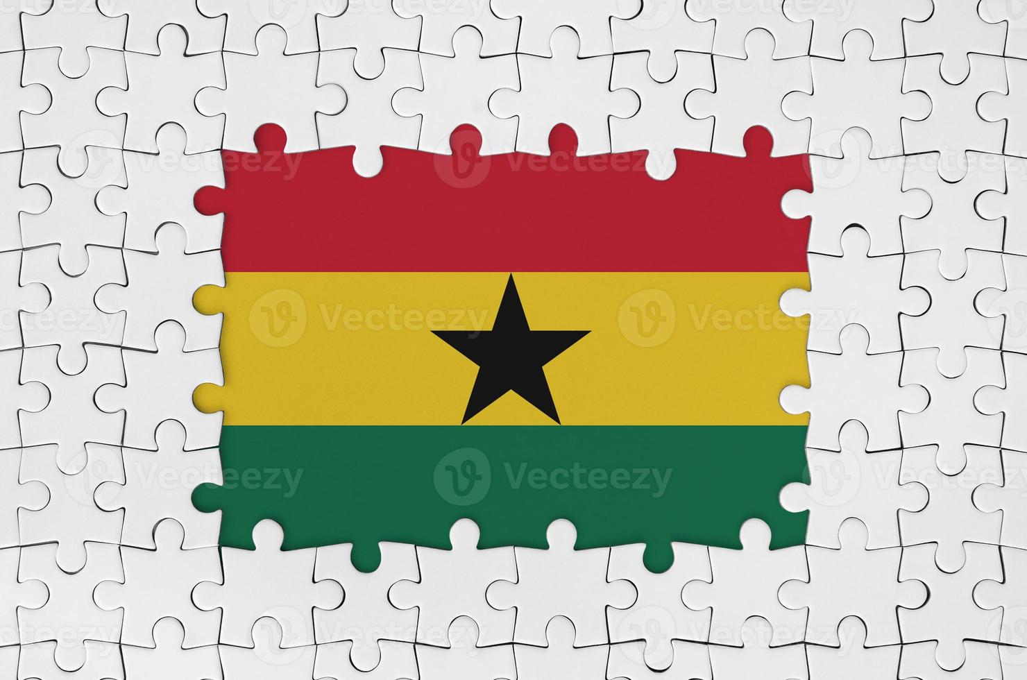 Ghana flag in frame of white puzzle pieces with missing central part photo