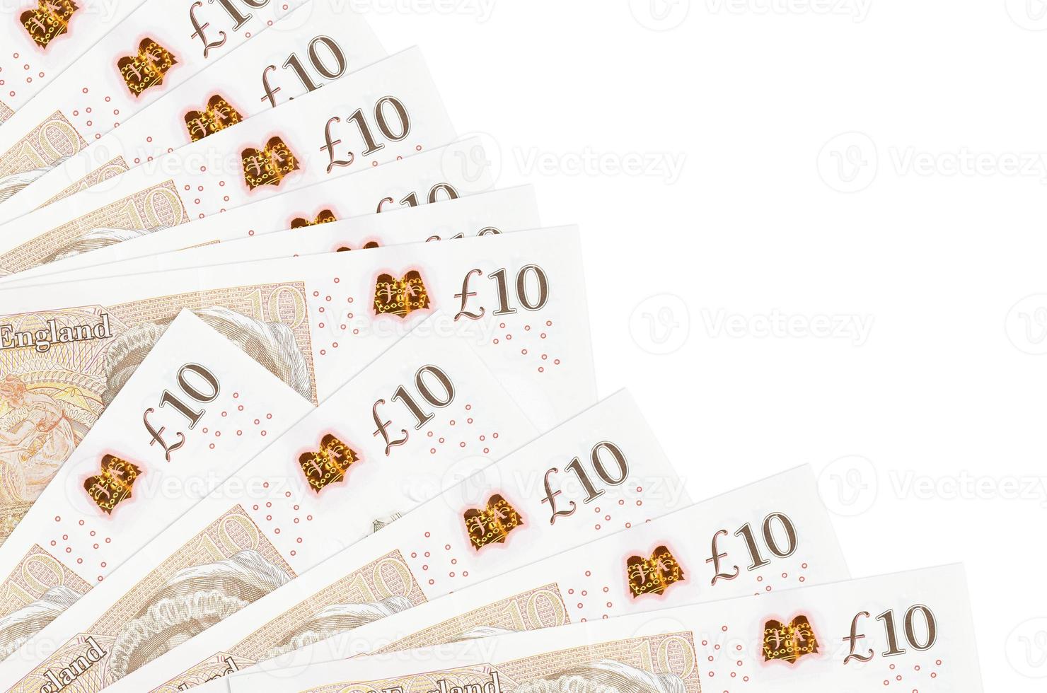 10 British pounds bills lies isolated on white background with copy space stacked in fan close up photo