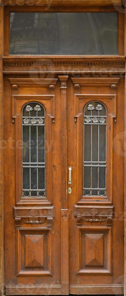 Old ancient wooden door texture in european medieval style photo