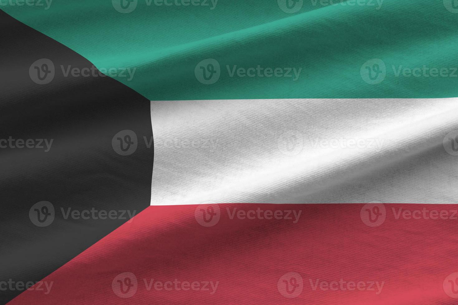 Kuwait flag with big folds waving close up under the studio light indoors. The official symbols and colors in banner photo