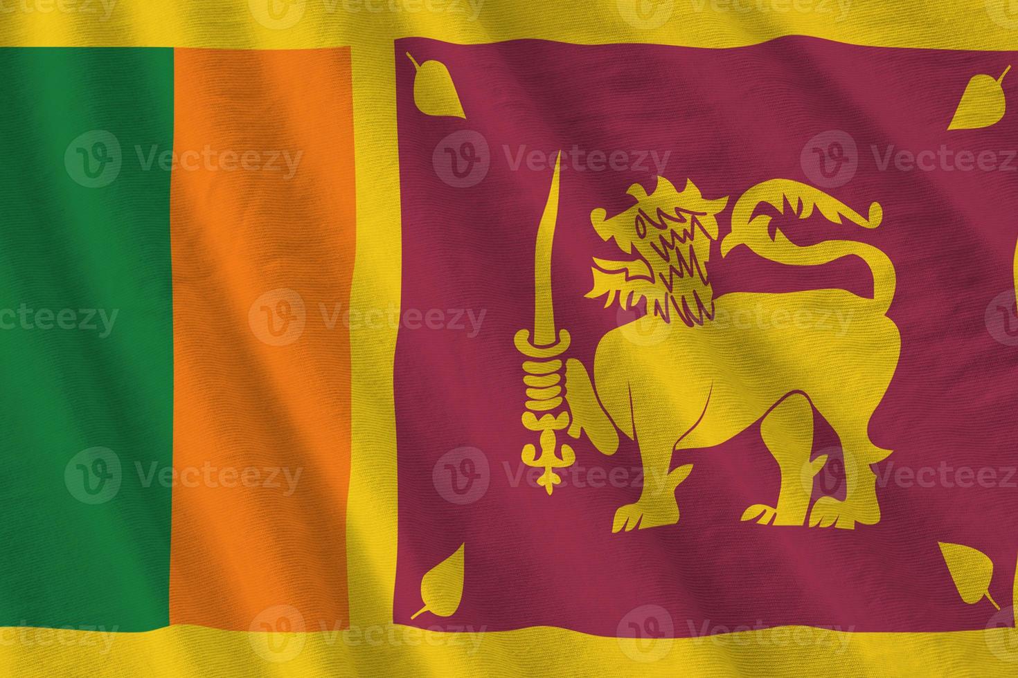 Sri Lanka flag with big folds waving close up under the studio light indoors. The official symbols and colors in banner photo