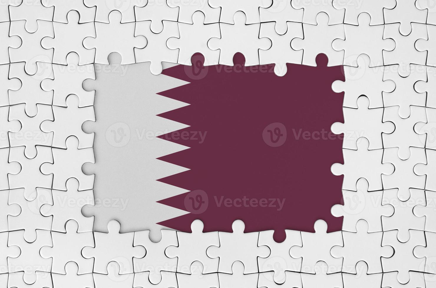 Qatar flag in frame of white puzzle pieces with missing central part photo
