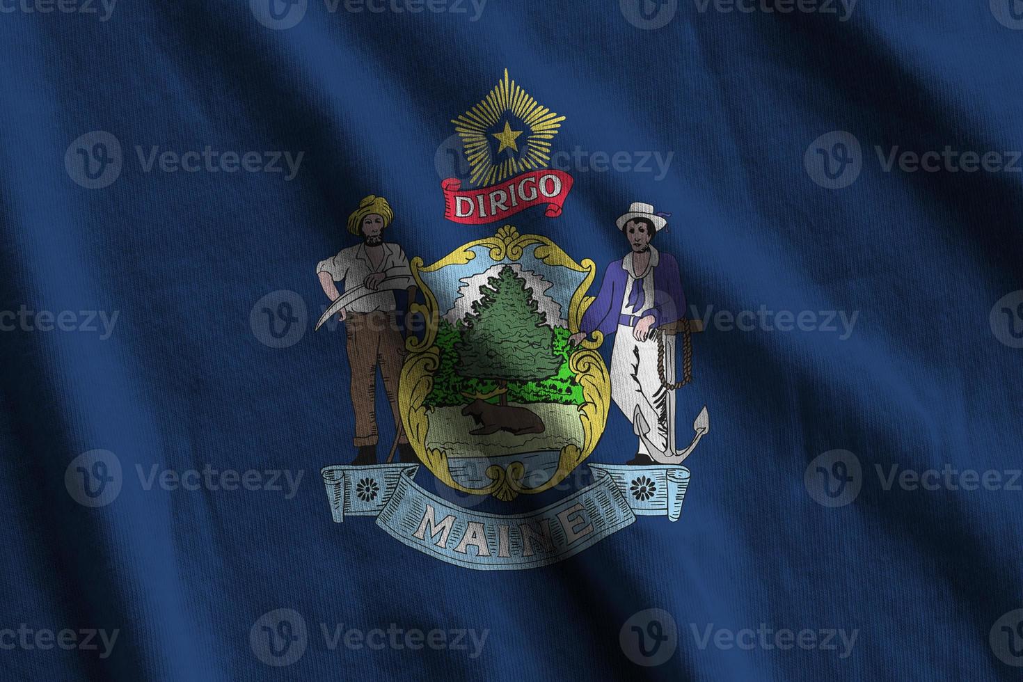 Maine US state flag with big folds waving close up under the studio light indoors. The official symbols and colors in banner photo