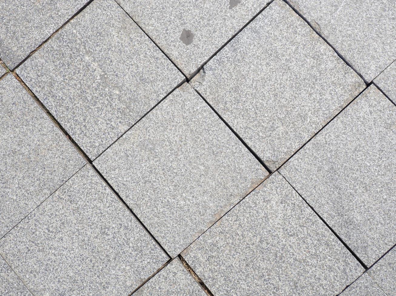 Drawing tiles on the pavement. Stone street surface. Masonry. photo