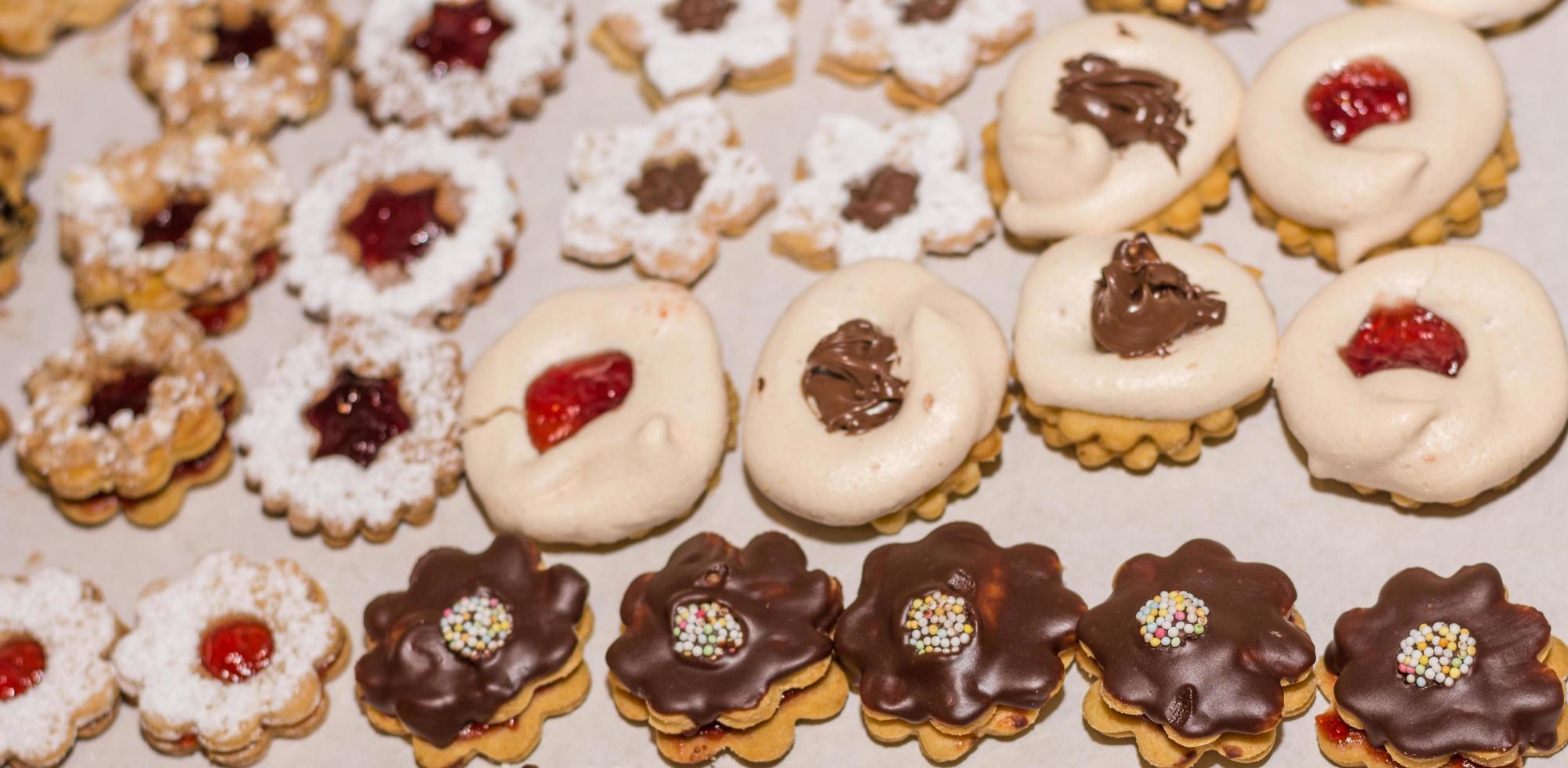 different christmas cookies with chocolate marmelade and sugar panorama photo