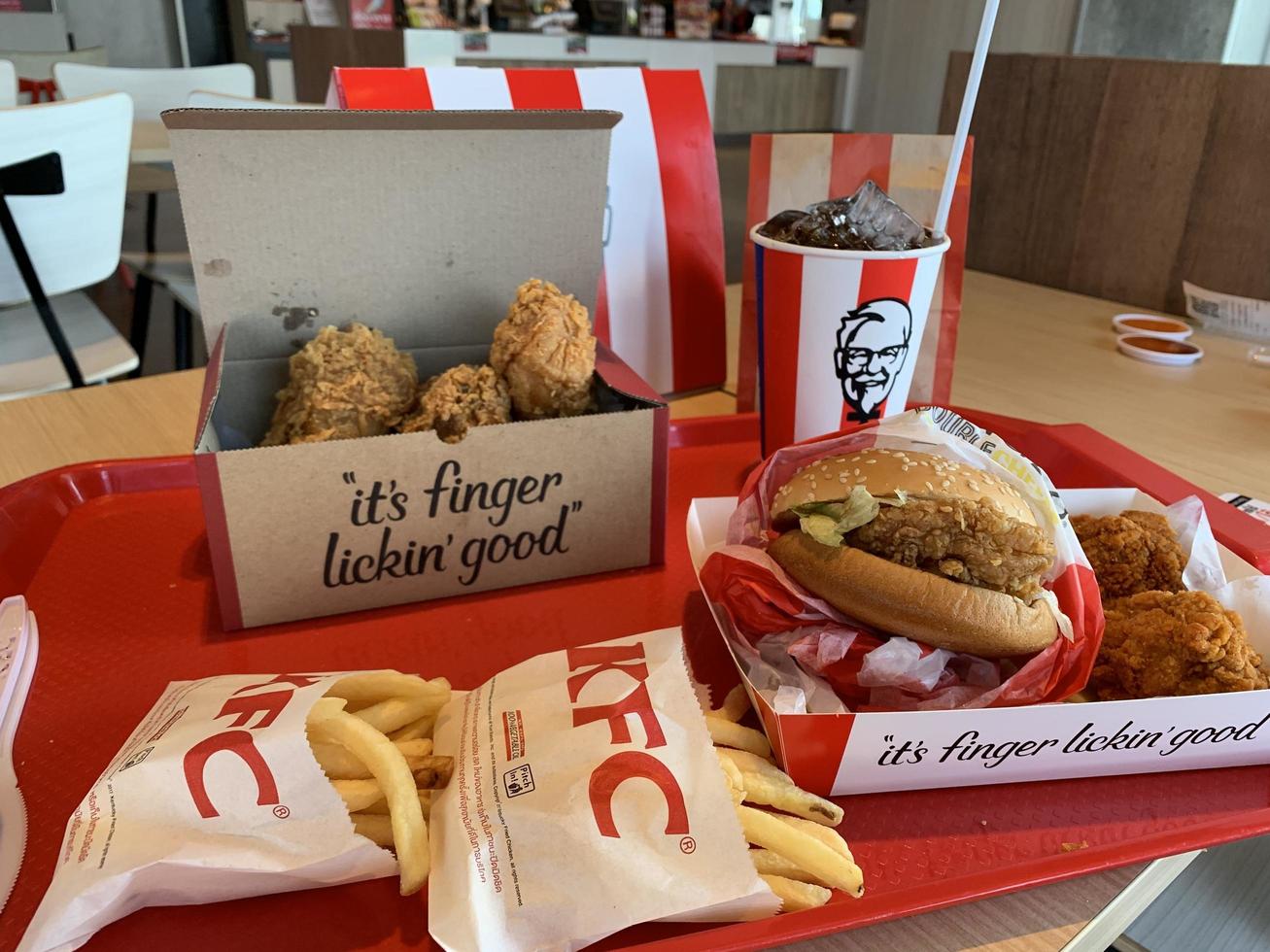 Ayutthaya,Thailand - Apr 06,2022- KFC Hamburger and Fried Chicken set at fast food restaurant Kentucky Fried Chicken KFC is a large restaurant chain. At Big C, Wangnoi branch in Thailand - Asia. photo