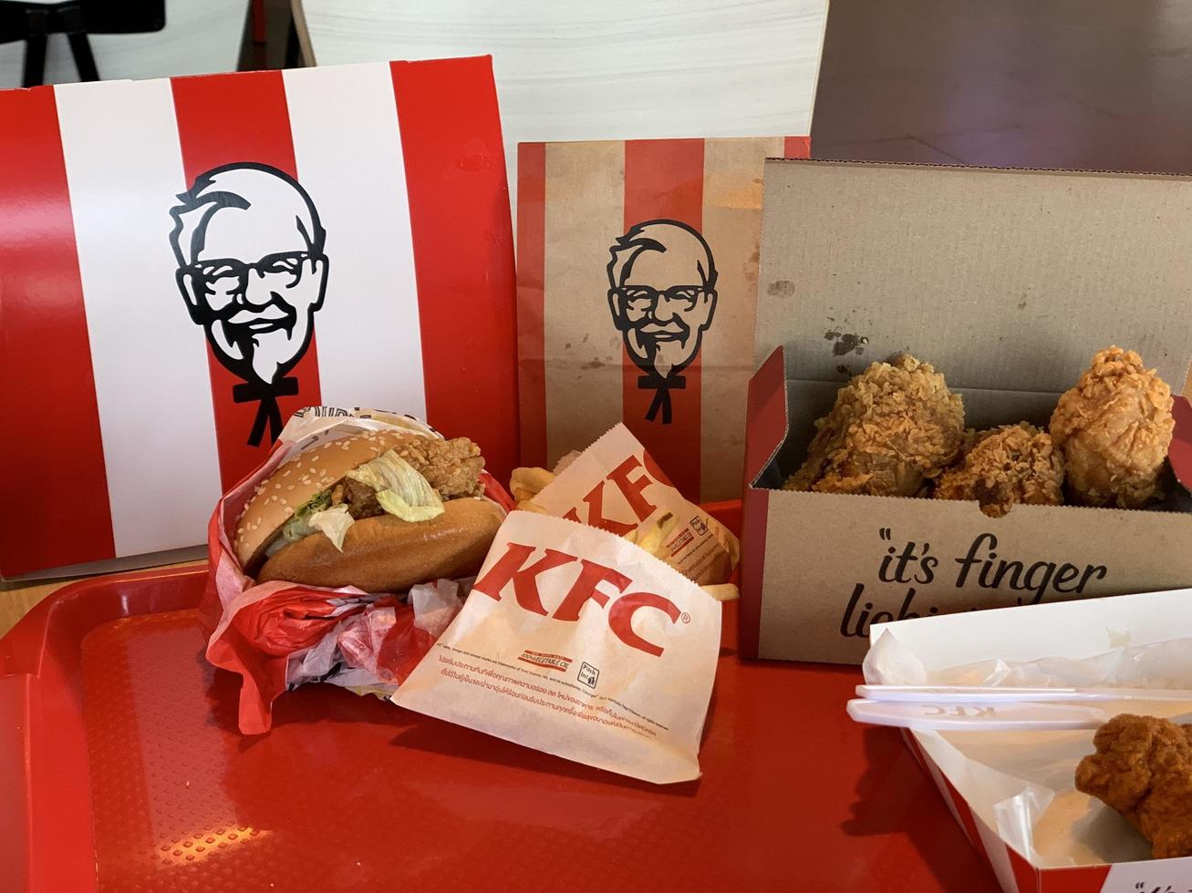 Ayutthaya,Thailand - Apr 06,2022- KFC Hamburger and Fried Chicken set at fast food restaurant Kentucky Fried Chicken KFC is a large restaurant chain. At Big C, Wangnoi branch in Thailand - Asia. photo