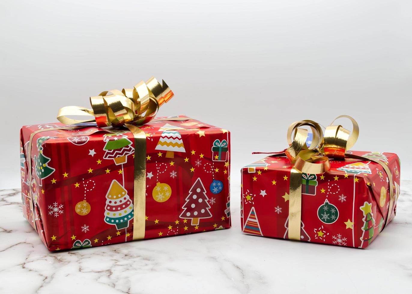 Christmas gift boxes isolated on marble background. Copy space for your text photo