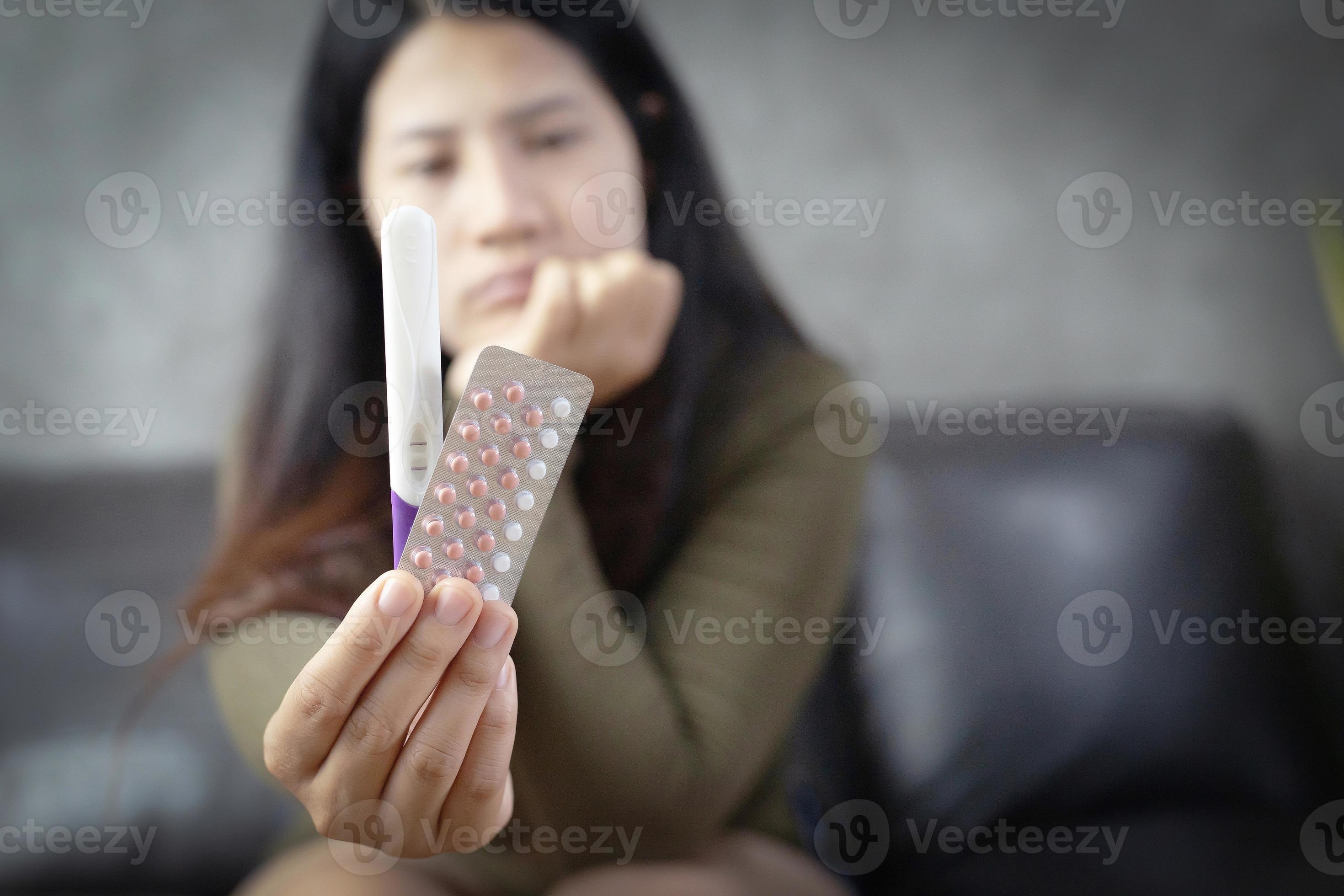 Women Holding Birth Control Pills With Pregnancy Test Kits 15656686 women-holding-birth-control-pills-with-pregnancy-test-kits-15656686