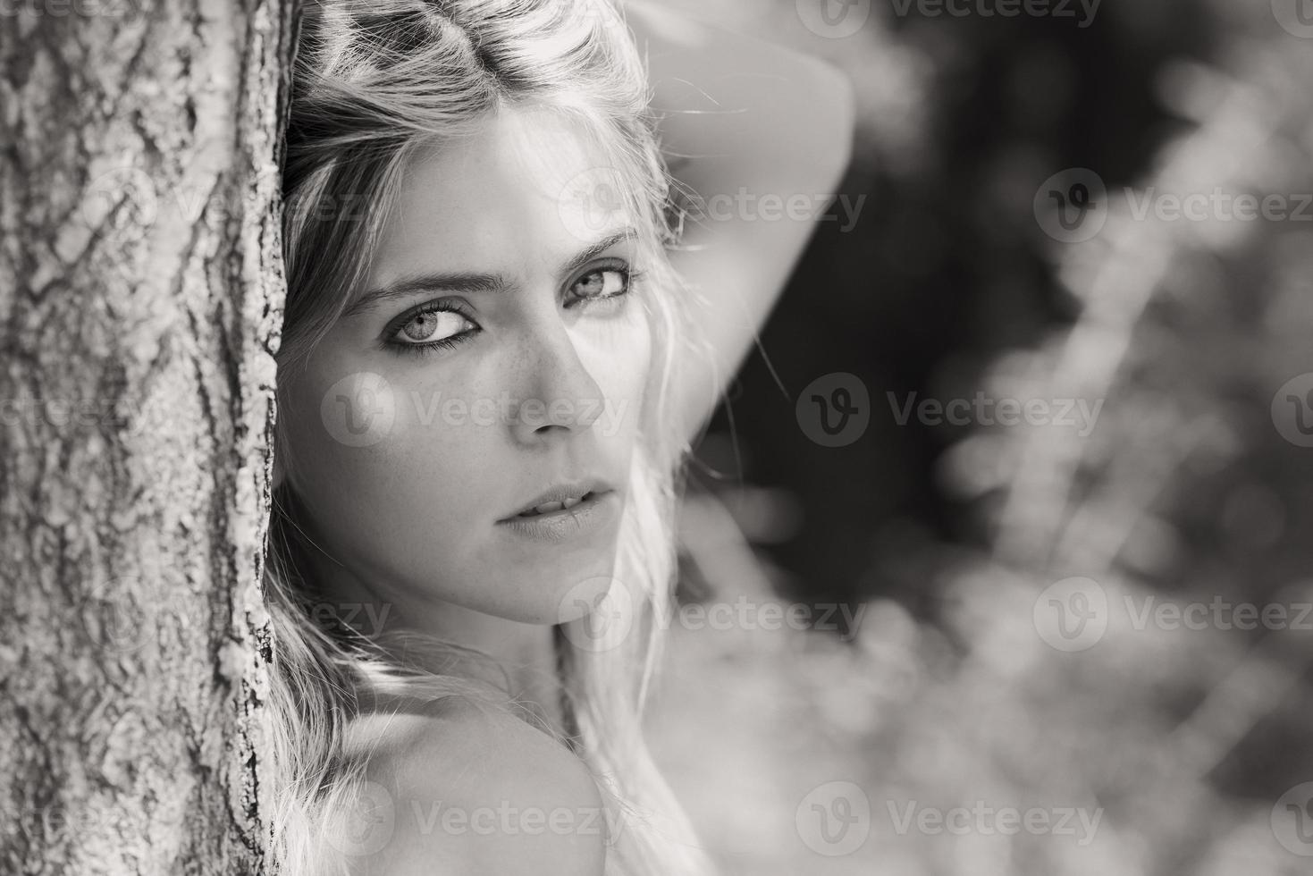 Portrait of beautiful blonde girl in black and white photo