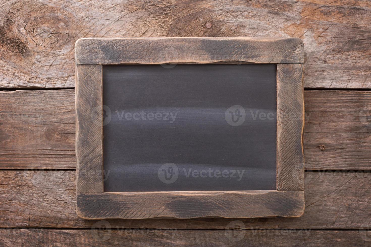 Wooden rustic background with a chalkboard photo