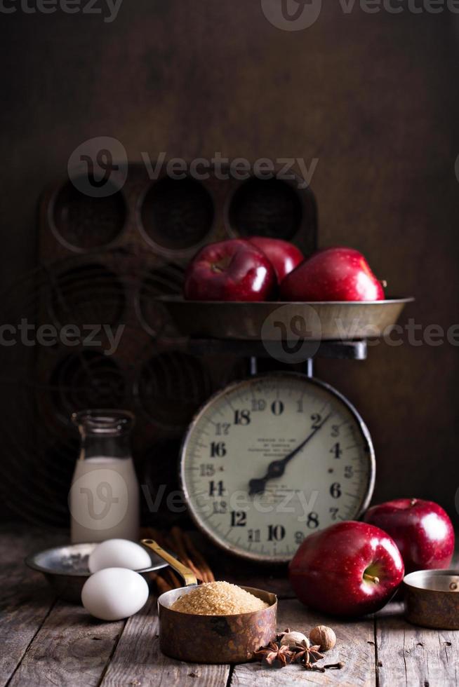 Baking with apples ingredients on rustic table photo