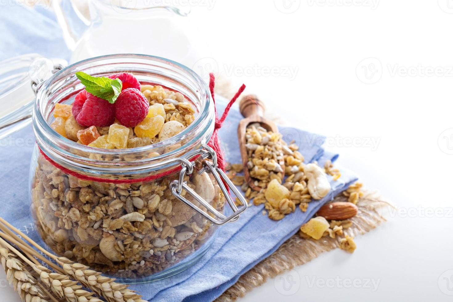 Homemade granola in a glass jar photo