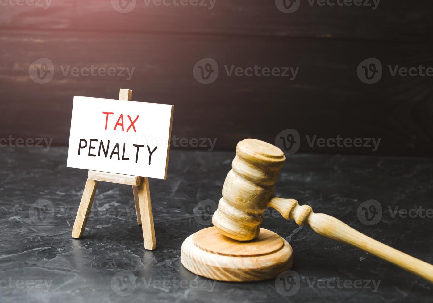 Tax penalty. Appointment of court punishment for non-payment of taxes and avoidance. Underpayment of estimated tax. Fine. Anti-money laundering and non-fulfillment of obligations to the state. photo