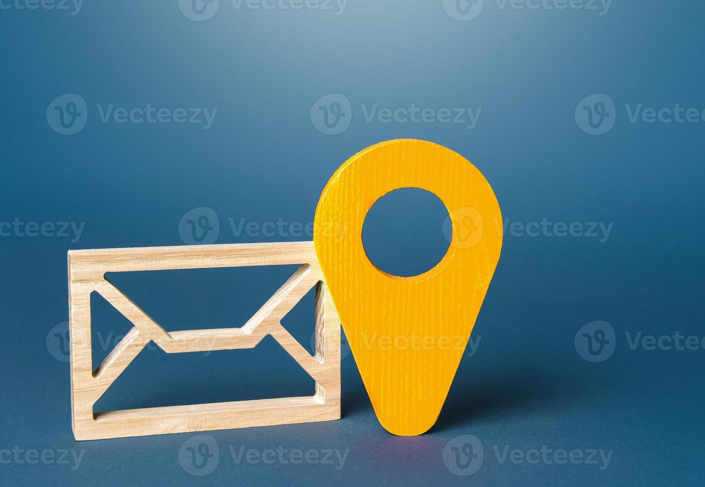 Envelope and yellow location symbol. Delivery of correspondence and documents. Communication, e-mail newsletter. Security and confidentiality. Sending price lists and special offers for customers. photo