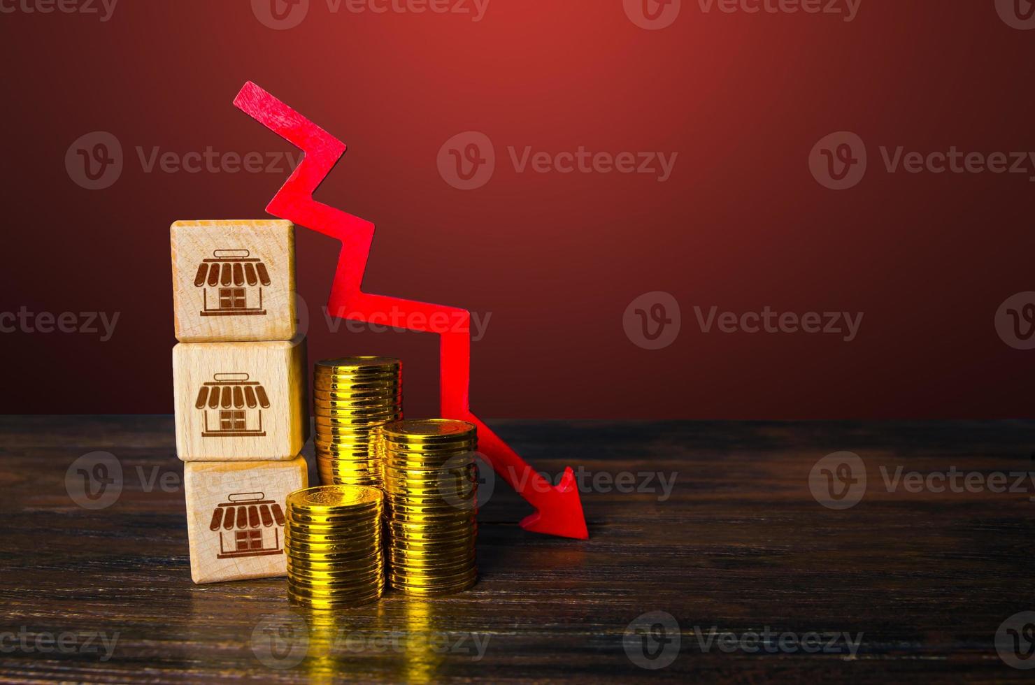 Downsizing business. Optimization and reorganization. Reducing outlets. Falling profits. Reduction and termination of investments. Crisis and bankruptcy. Cost reduction. photo