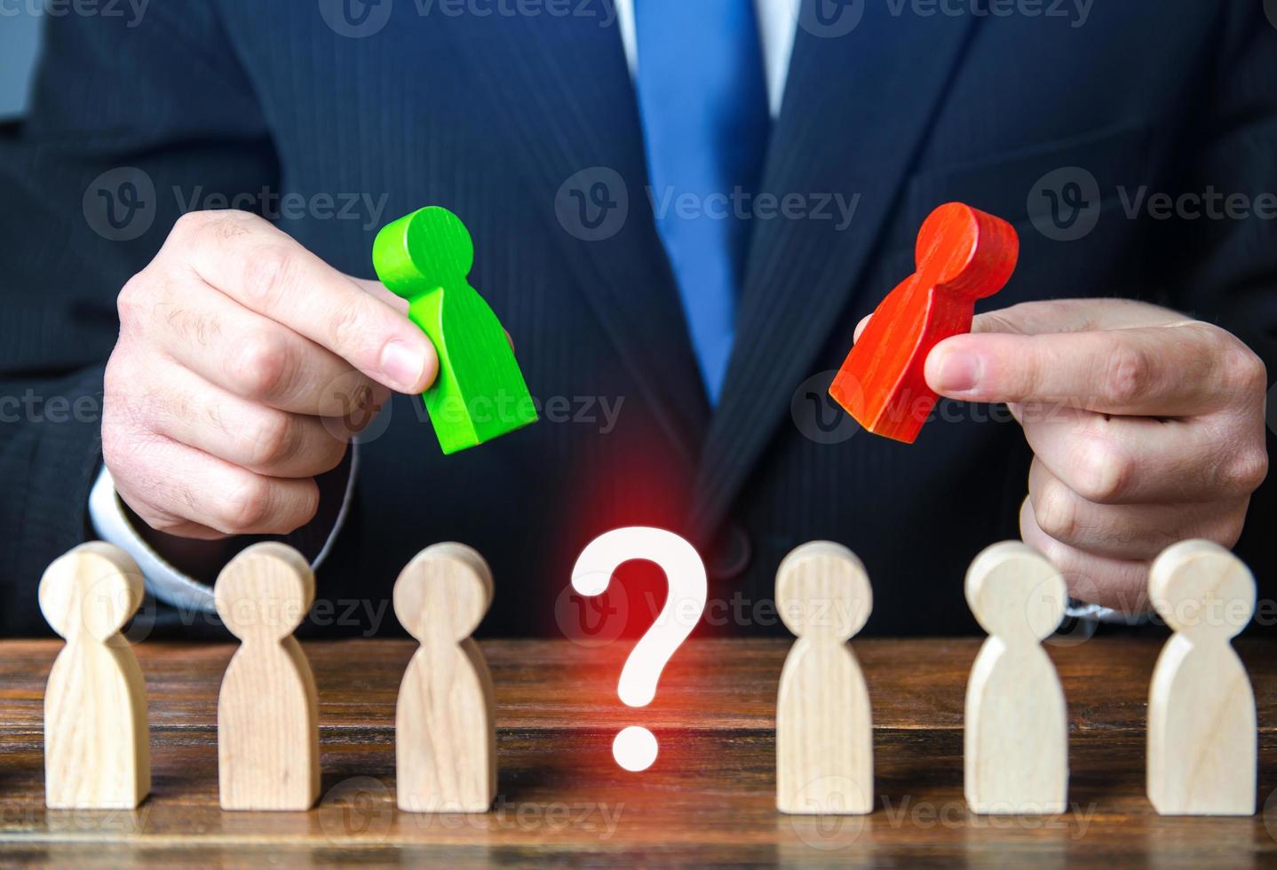 Businessman chooses a candidate for a vacancy. Hiring the best specialists in the company staff, human resources. Headhunting. Testing and interviewing new employees. Selection criteria. Leading post photo