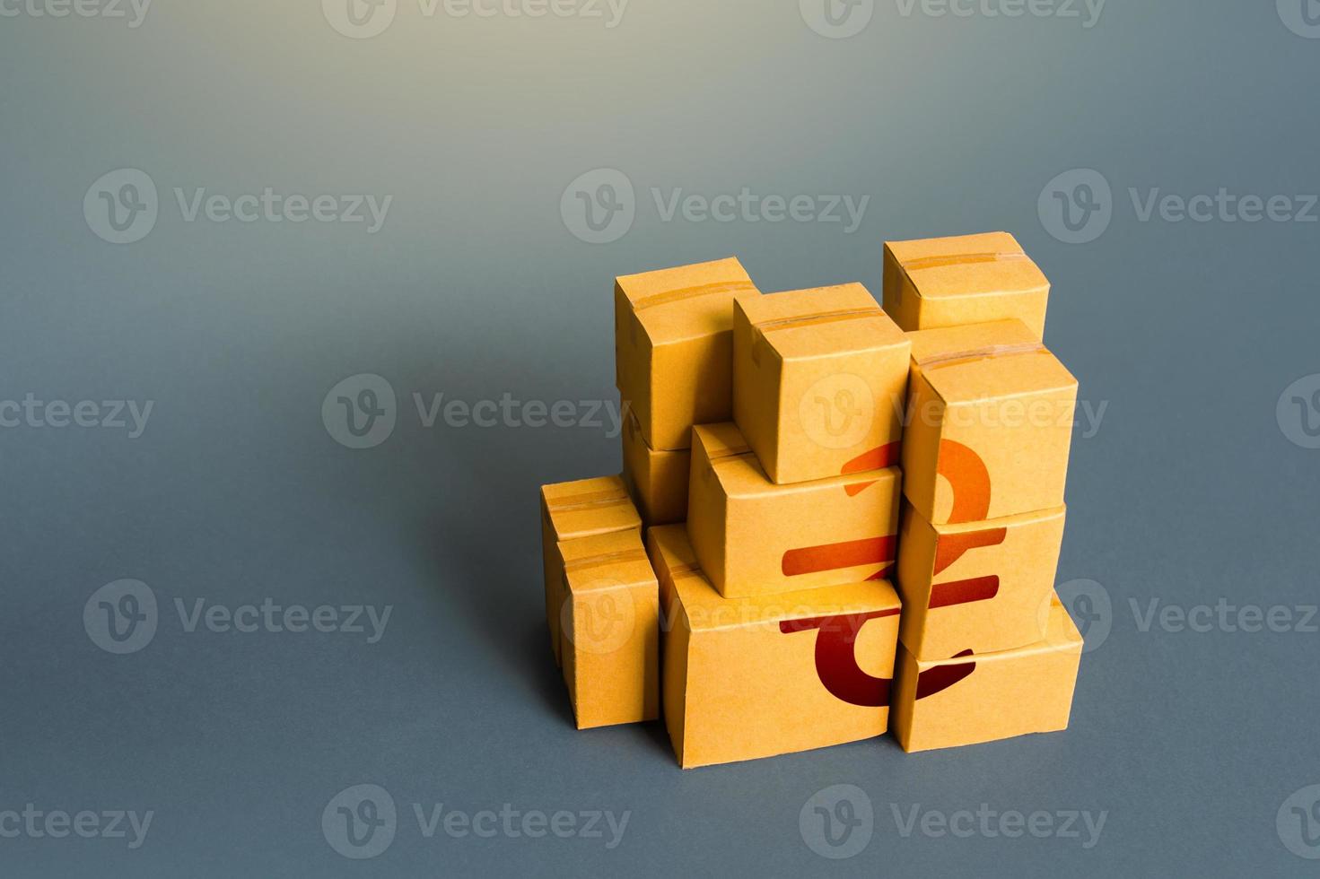 Boxes with ukrainian hryvnia symbol. Distribution of goods. Transportation logistics. Retail of products. Consumption economics, imports and exports. GDP. Manufacturing industry and trade. photo