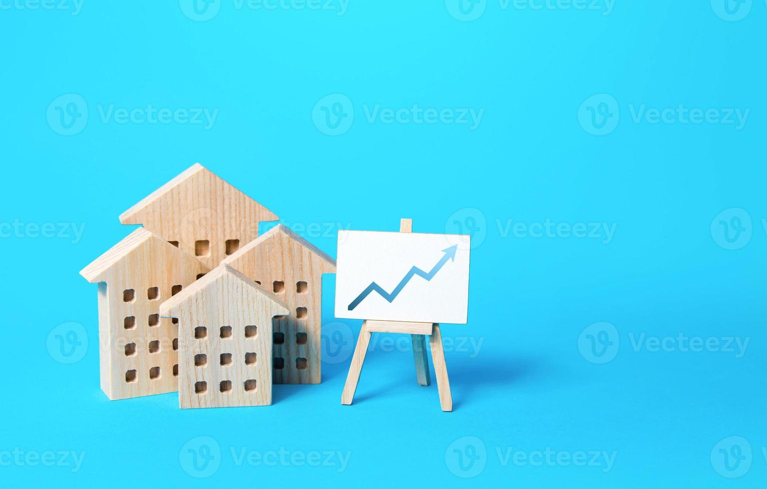 City real estate and easel graph arrow up. Market heating growth, attracting investments. Rising prices and construction costs. Economic recovery and the value of realty. Mortgage rates. Loan photo