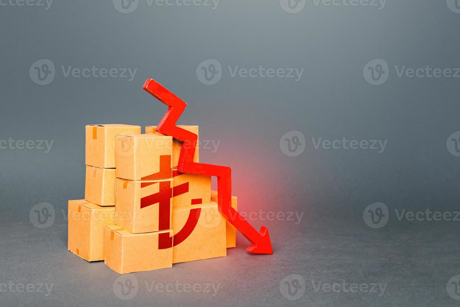Boxes with turkish lira symbol and down arrow. Decrease in stocks of products. Worsening trade. Embargo, sanctions. Low consumption. Economic slowdown. Price reduction. Fall in the production of goods photo
