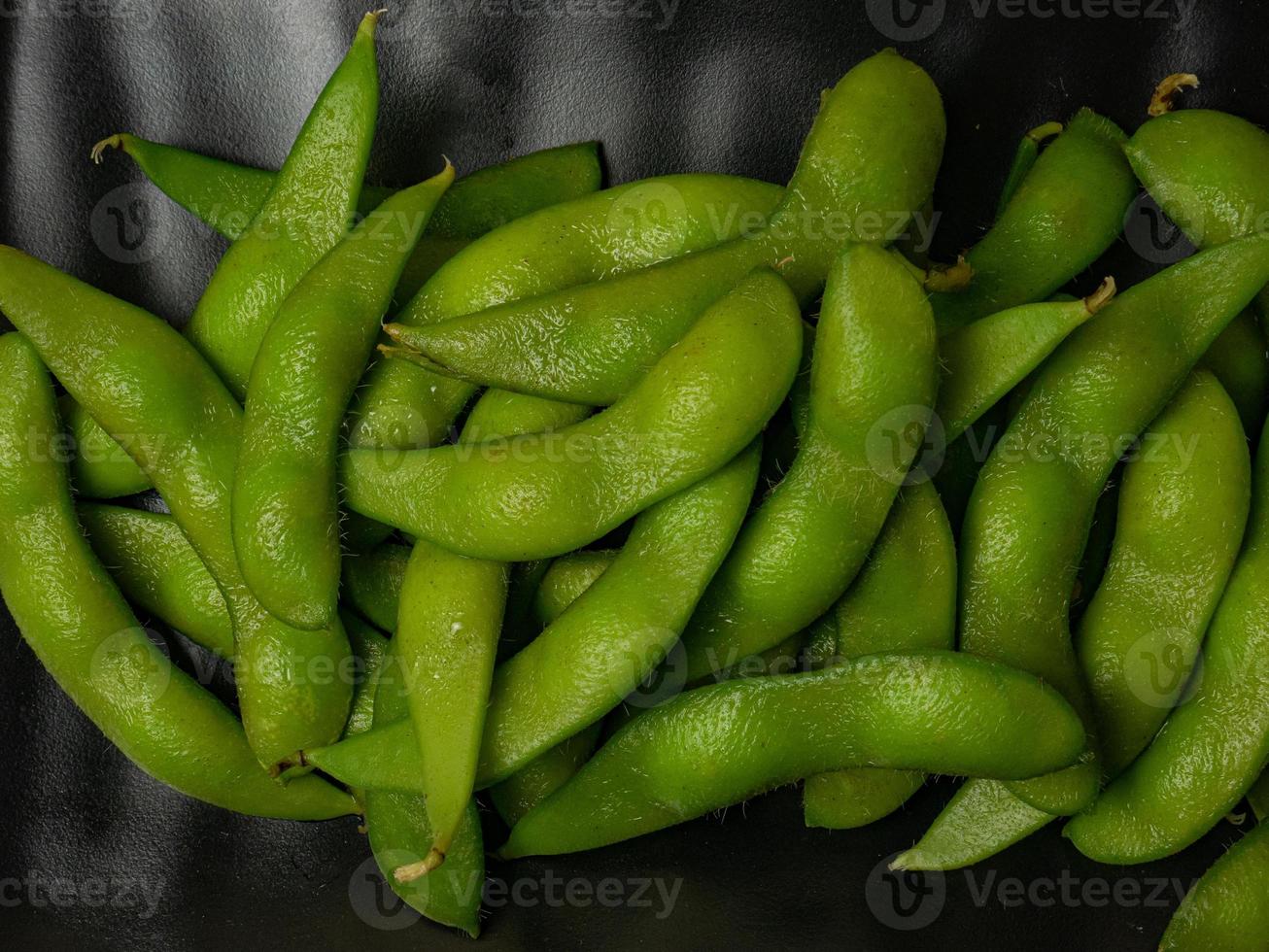The  edamame on black plate for food concept photo