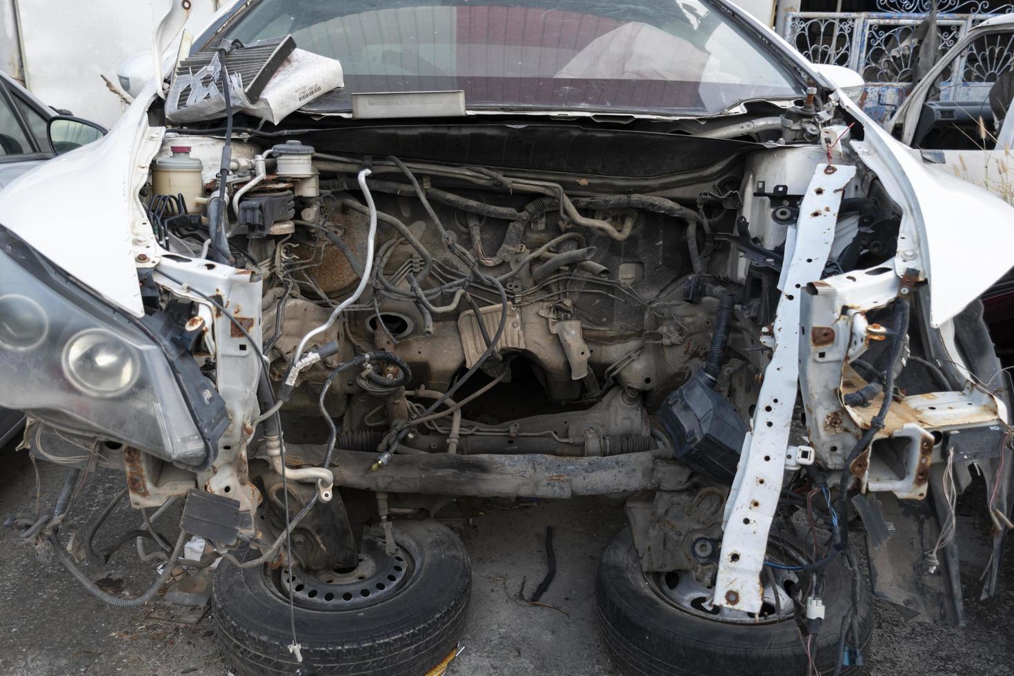 Old wrecked cars in junkyard photo