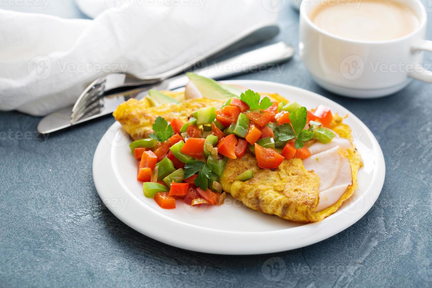 Omelet with ham and avocado photo