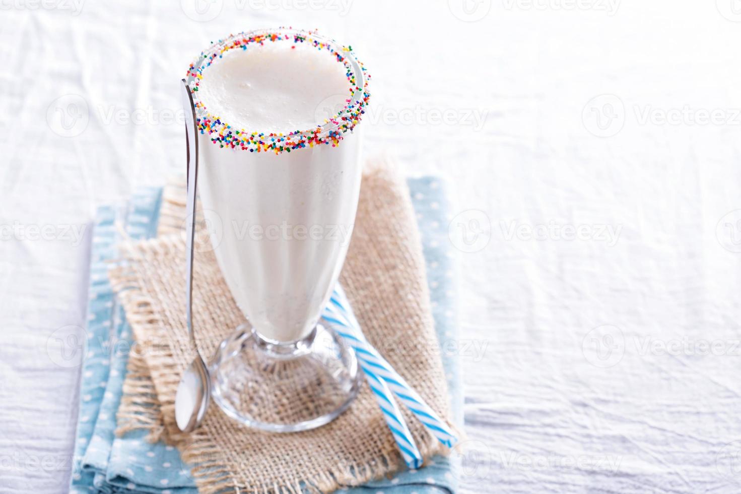 White chocolate milkshake in tall glass photo