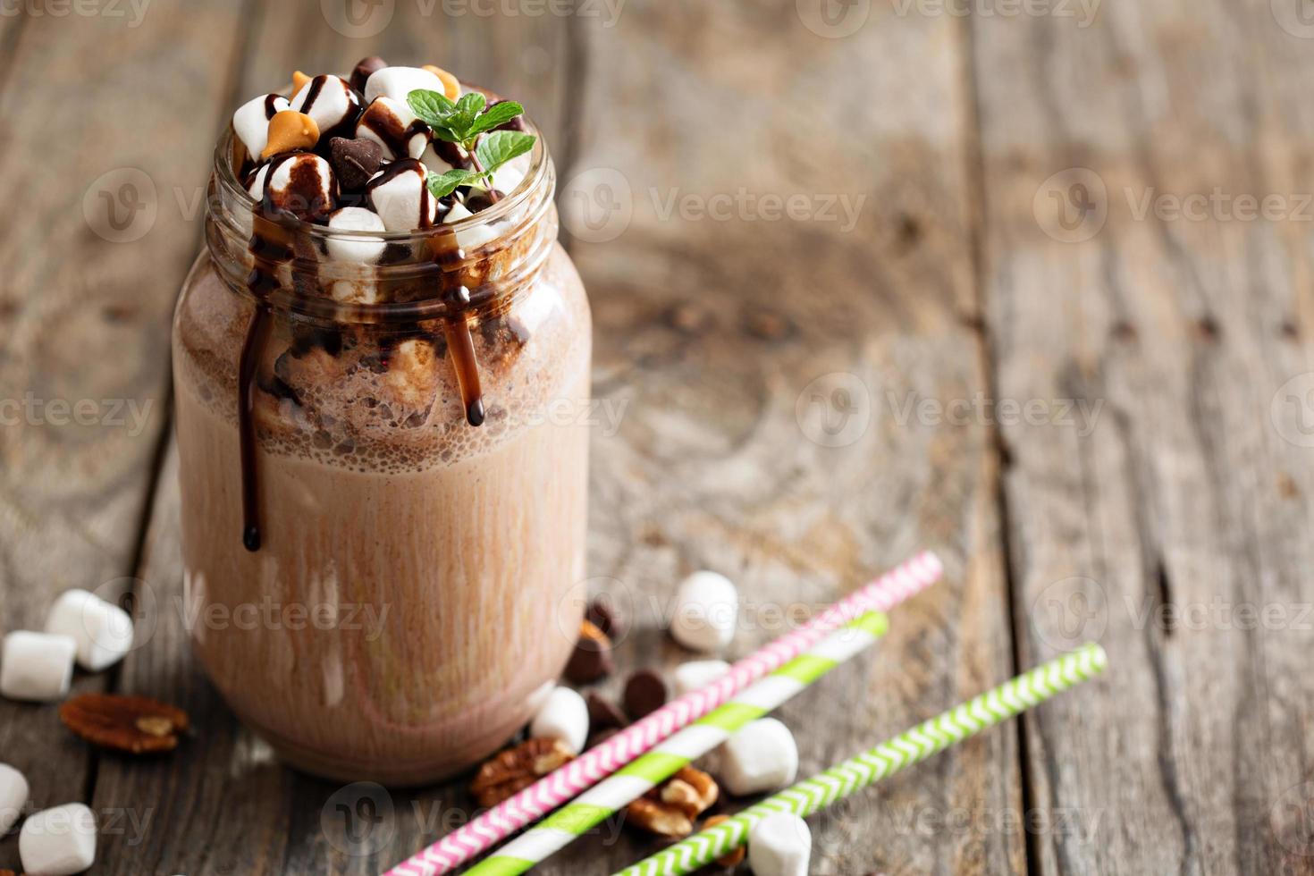 Chocolate shake with sauce and marshmallows photo