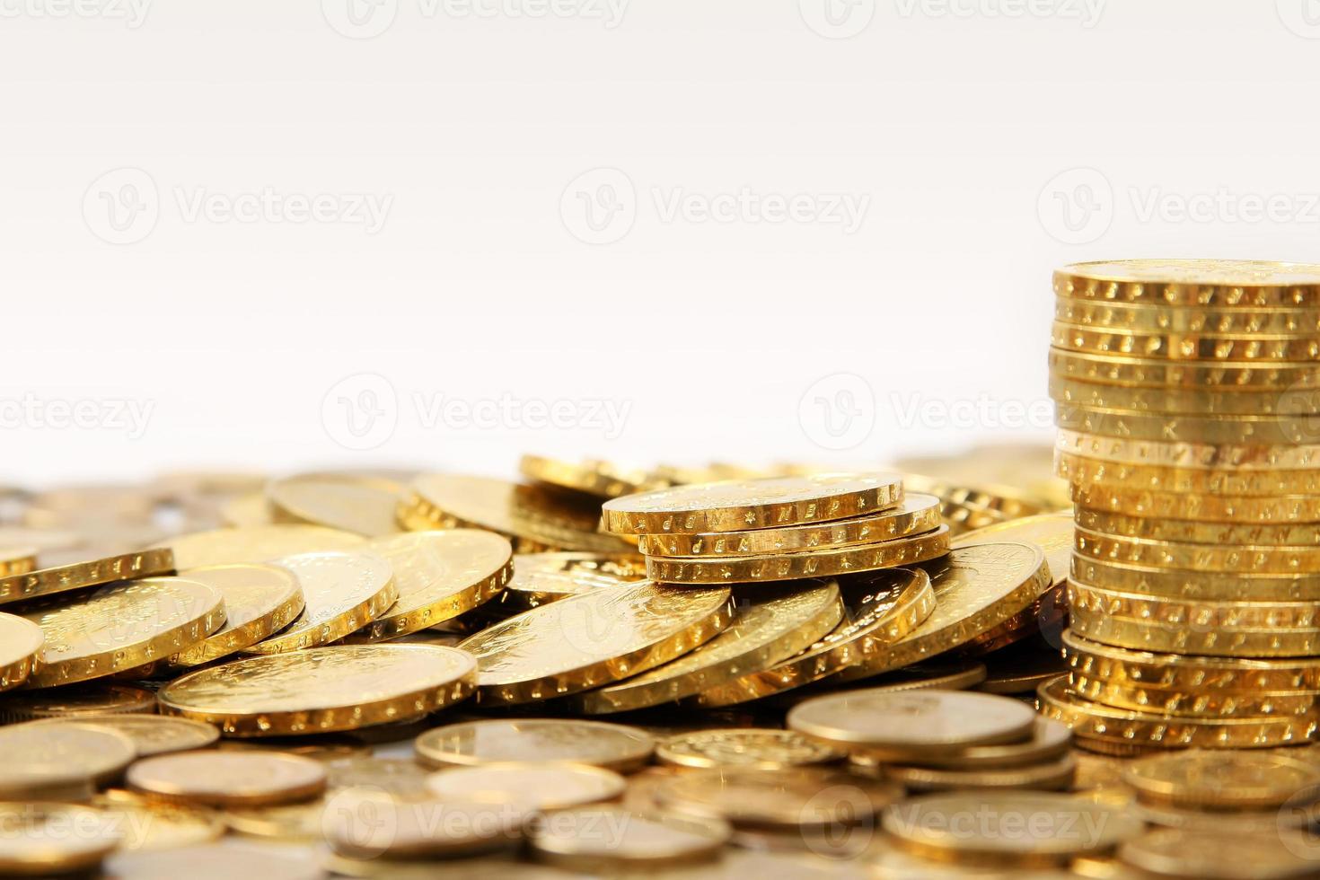 Gold coins on white background photo