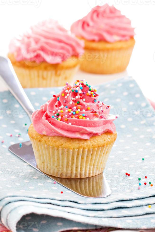 Cupcakes with frosting and sprinkles photo