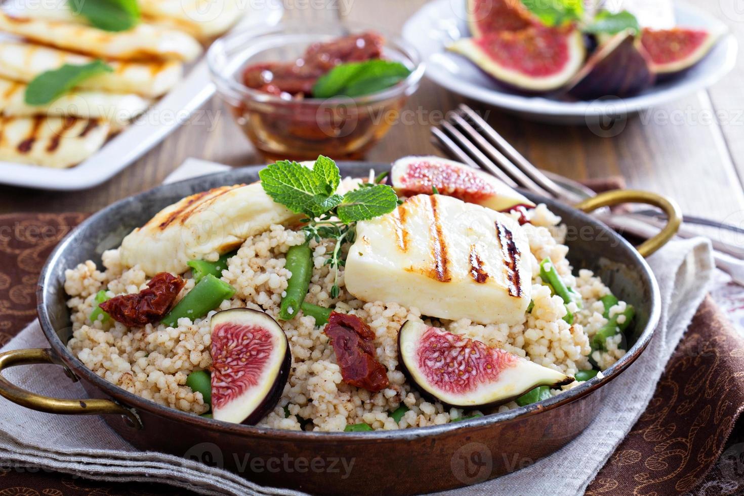 Spiced cous-cous with green beans and cheese photo