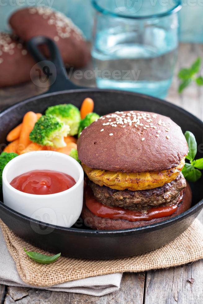 Beef burgers with pineapples and chocolate buns photo