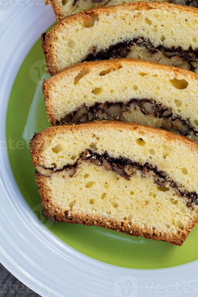 Pieces of pound cake with nuts and chocolate photo