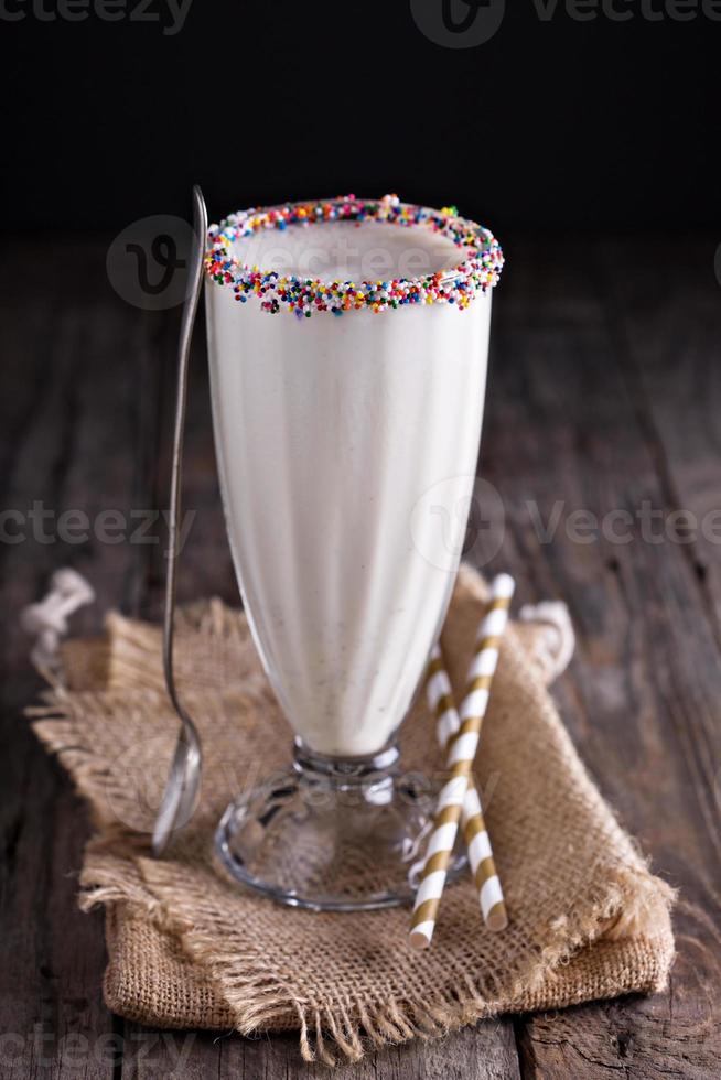 White chocolate milkshake in tall glass photo